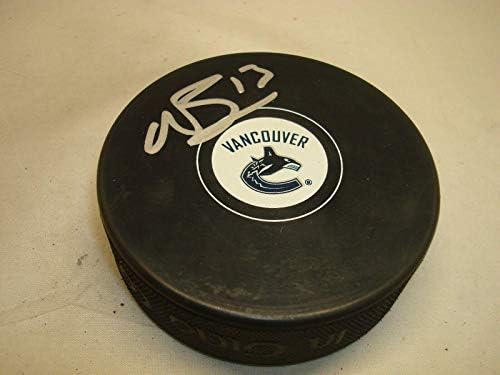 Nick Bonino assinou o Vancouver Canucks Hockey Puck autografado 1b - Pucks autografados da NHL