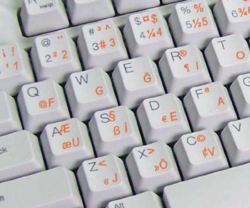 Decalques de teclado turcos F com um fundo transparente de letras laranja