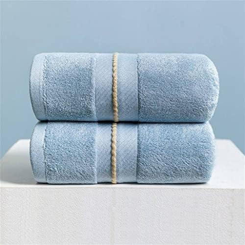 n/Um garoto de toalha grande lavar uma casa de rosto absorve água para aumentar a toalha espessante